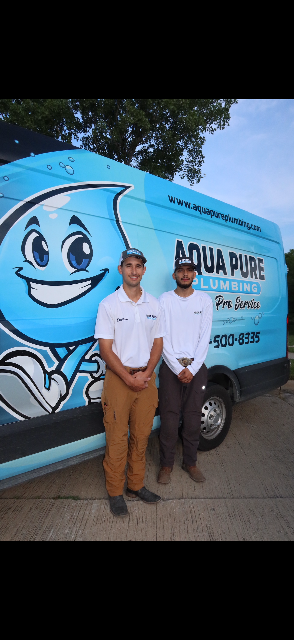 Aqua Pure Plumbing team standing in front of the company van